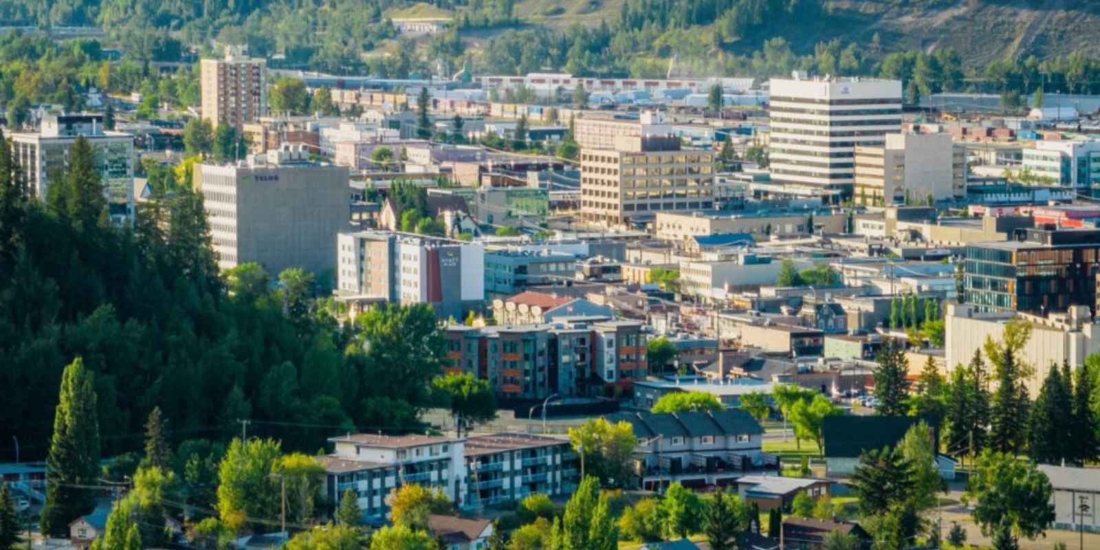 Downtown Prince George British Columbia surrounded by trees and forested hills