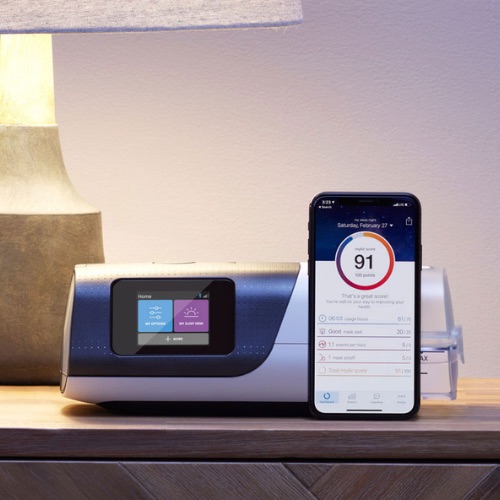 ResMed AirSense 11 CPAP machine with myAir app on a nightstand